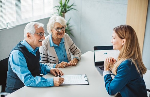 senior couple with financial advisor